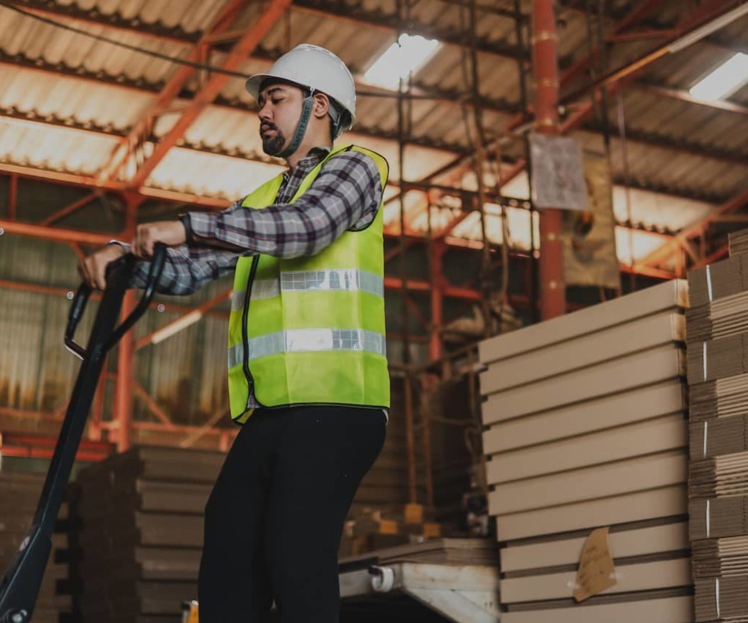 Plant manager working in a warehouse.